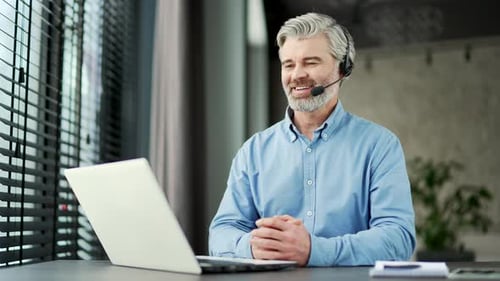 Smiling Man Having Video Call On Laptop