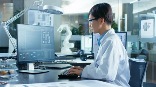 Man Typing Code in Tech Office