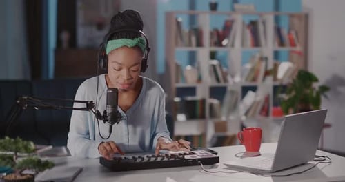 Young Woman Creating Music at Home Studio