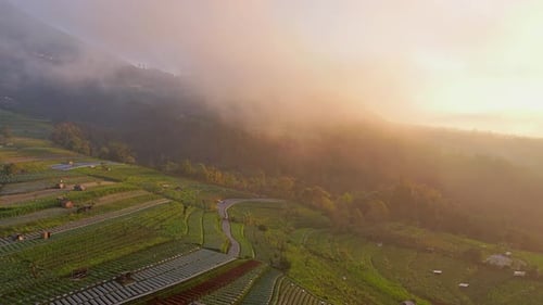 Scenic Aerial View of Farm on Mountain at Sunrise
