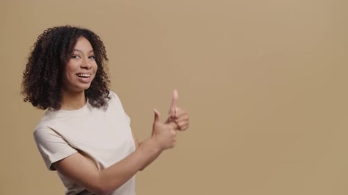 Smiling Woman Pointing to Side with Both Hands