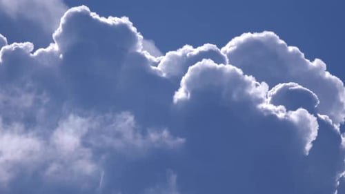 Billowing White Clouds Against Vibrant Blue Sky