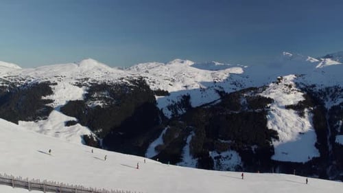 Skiers on Snowy Mountain in Winter Aerial View