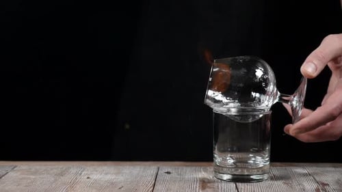 Cocktail Glass Burning Over Lowball Glass