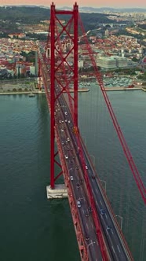 Aerial View of 25 De Abril Bridge Over the Tagus River at Sunset in Lisbon Portugal
