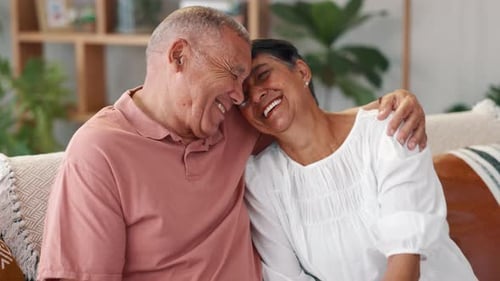 Senior Couple Embracing Affectionately at Home