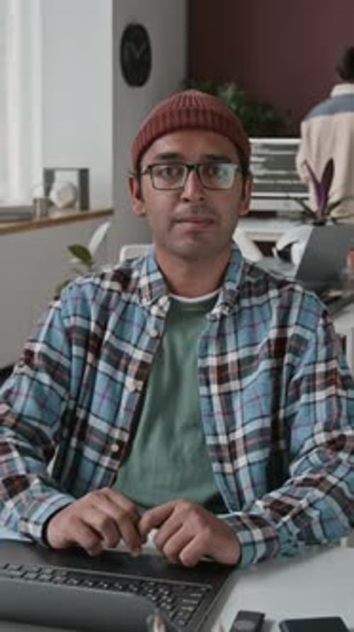 Timelapse Portrait of Stressed Indian Male Programmer at Workplace