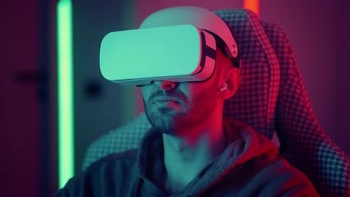 Young Adult Immersed in Virtual Reality Headset