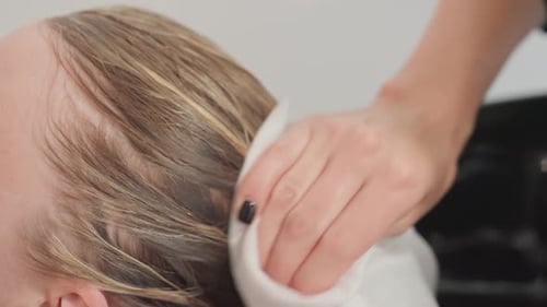 Client Receiving Professional Hair Rinse with Scalp Massage and Smoothing Relaxed Customer in Cape