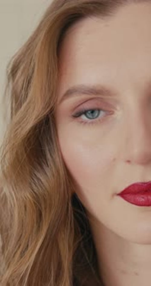 Elegant Model with Vibrant Makeup Closeup Shot Emphasizing Striking Features and Sophisticated Style