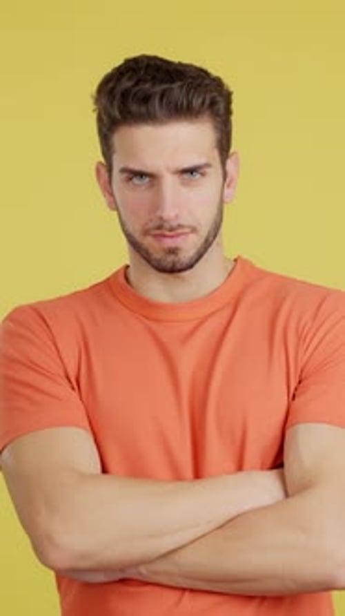 Caucasian Man Crossing the Arms with an Angry Expression