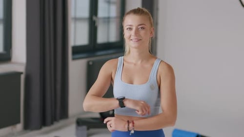 Smiling Woman in Fitness Studio