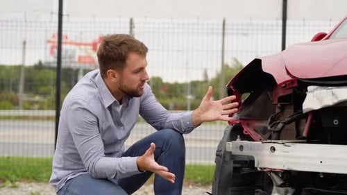 Upset Driver After Car Crash on the Road Side