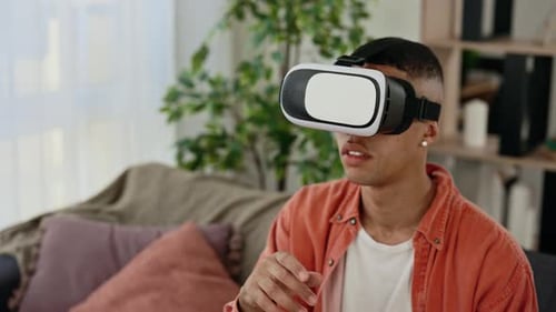 Close View of the Multi Ethnic Man Use Vr Headset Glasses at Home for Studying Purposes