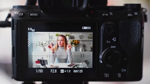Woman Records Makeup Tutorial With Lipstick