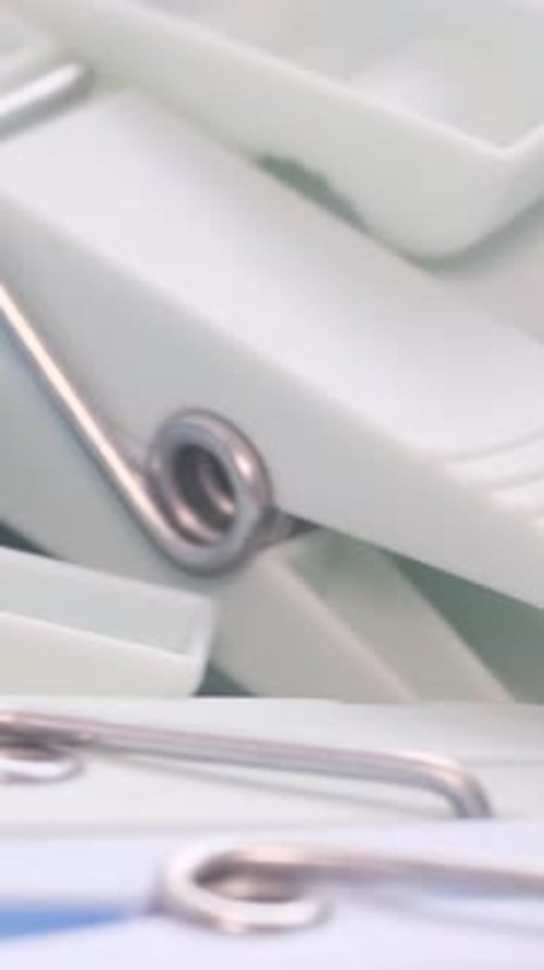 Macro Video Clothespins Rotate in a Circle Dry Clothes The Concept of Washing Clothes Vertical Video