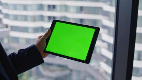 Executive Hand Holding Green Screen Tablet in Office Closeup Elegant Manager