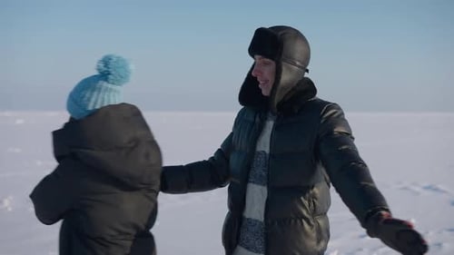 Smiling Loving Man Holding Hand of Woman Spinning in Slow Motion Hugging Looking at Camera