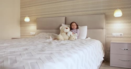 Cute Little Child Girl Playing with Teddy Bear