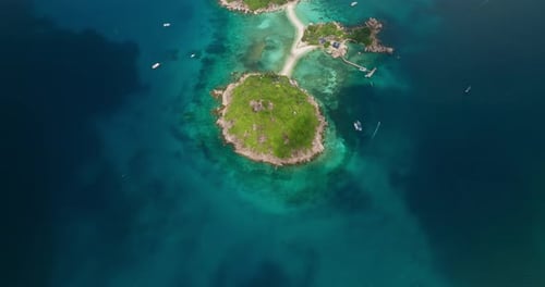 Birds eye tilt up reveal shot of Koh Nang Yuan Island, Koh Tao in Thailand