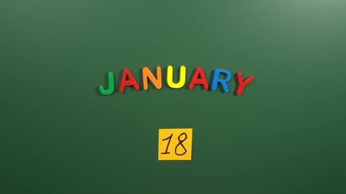 Hand sticking a sticker 18 January calendar day on school board. 18 date of January. Eighteenth day