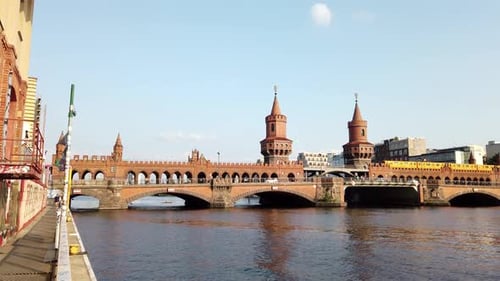 Urban Scenery of Famous Oberbaum Bridge in Berlin with Yellow Train