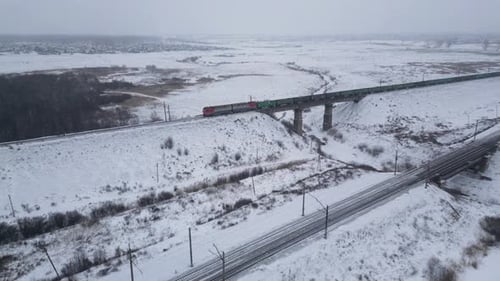 Aerial View of Cargo Train at Winter Time Delivery Concept