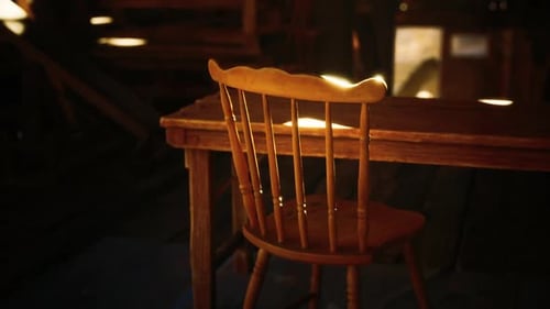 Cinematic Light Beam Moves Across Old Wooden Chair and Table