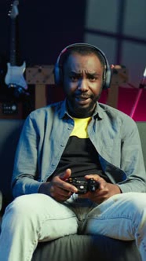 Young Adult Playing Video Game with Controller