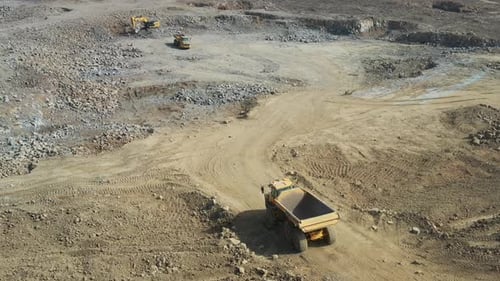 Aerial video of work in the construction area of heavy machinery in motion
