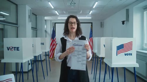 Woman Explains Voting Ballot at Polling Station