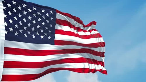 Waving American Flag Against Blue Sky