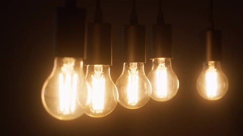 Satisfying Close Up of Turning On Incandescent Light Bulbs