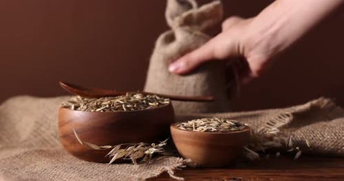 Wooden Bowls Filled with Grains and Burlap