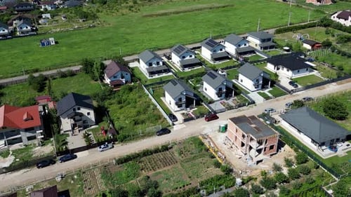 aerial zooming into rural gardens and homes in rural Romania