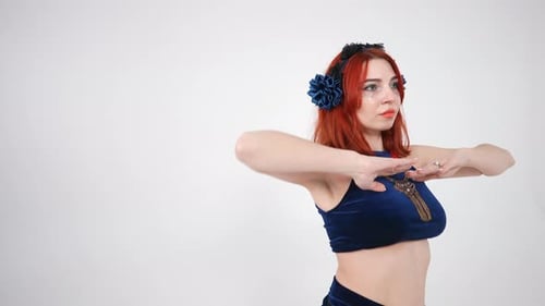 Back View Redhead Flexible Young Woman Turning Shaking Hips and Moving Hands Around Slim Body in