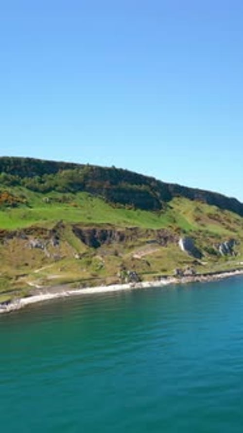 Social ratio aerial video of Glenarm on the Causeway Coastal Route on a bright and sunny day.