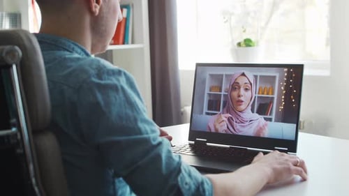 Boyfriend and His Muslim Girlfriend Have Online Call Conversation Via Internet Young People are