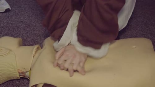 Practicing CPR on a Medical Training Dummy