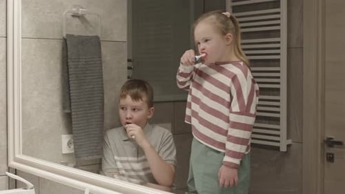 Children Brushing Teeth in Bathroom
