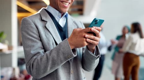 Office, man and happy with texting on smartphone for email notification, message and entertainment