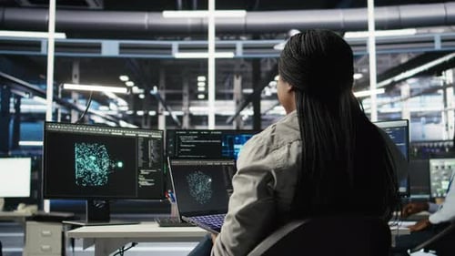 Woman Analyzing Data in Modern Tech Office