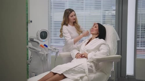 Woman Receives Facial Treatment at Medical Spa Clinic