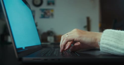 Woman Work at Home in the Night Using Laptop Computer Typing on Keyboard Closeup