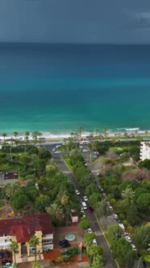 Vertical Video Above the Stormy Coast Aerial View of Mediterranean Coastline and Cityscape in Alert
