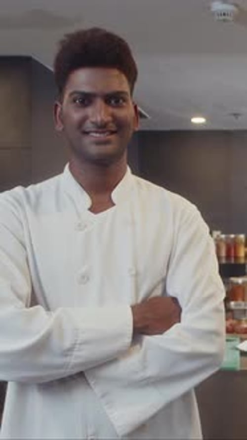 Indian Chef Smiling at Camera at Restaurant