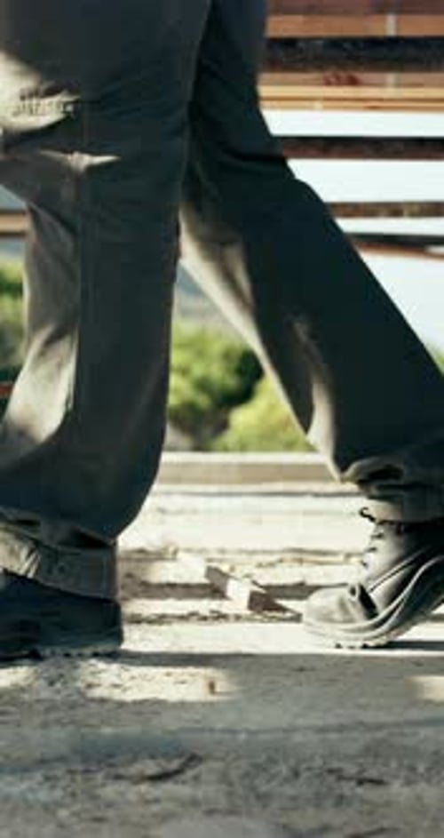Legs, walk and construction site for inspection, scaffolding for maintenance or renovation