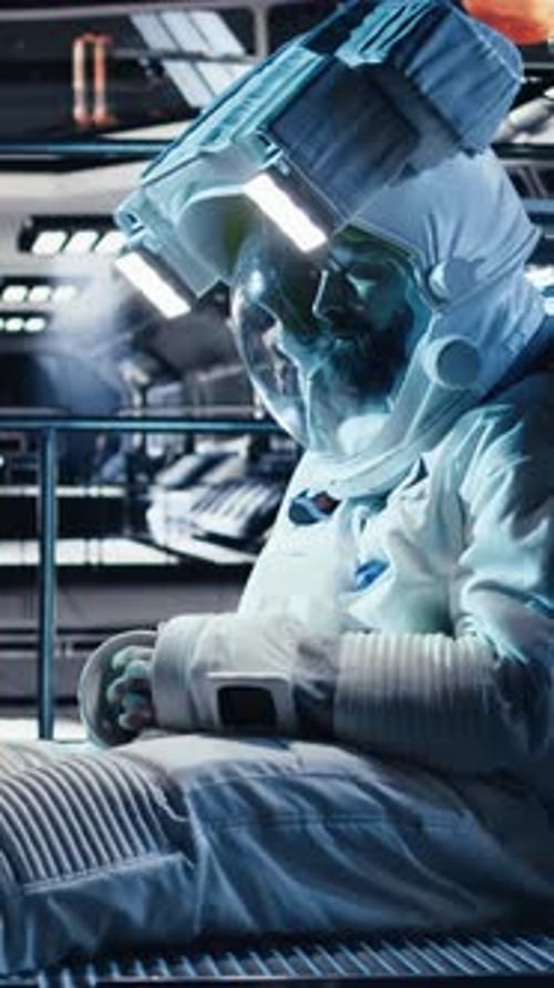 Vertical Video Astronaut Reviewing Onboard Analytics on Tablet Talking to Colleague