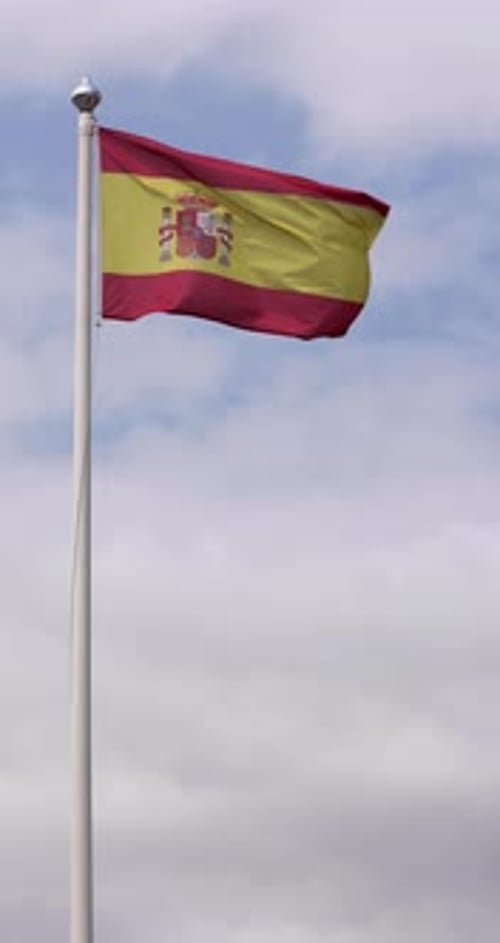 Spanish Flag Waving Against a Sky