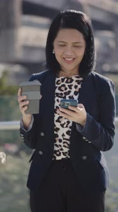 Vertical Video Elderly Beautiful Busy Female Texting on Coffee Break While Standing Outside